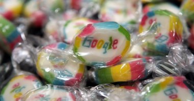 Pieces of candy featuring the Google logo are seen at the official opening of Google’s offices in Berlin, Germany, Sept. 26, 2012. (Getty Images Photo)