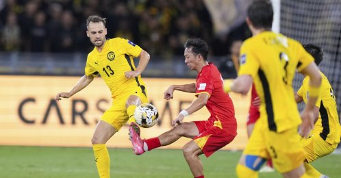 Vietnam's Chau Ngoc Quang (R) fight for control of the ball with Malaysia's Hector Hevel, during the AFC Asian Cup qualifier Group F football match between Malaysia and Vietnam at the National Stadium Bukit Jalil, Kuala Lumpur, Malaysia, June 10, 2025. (AP Photo)
