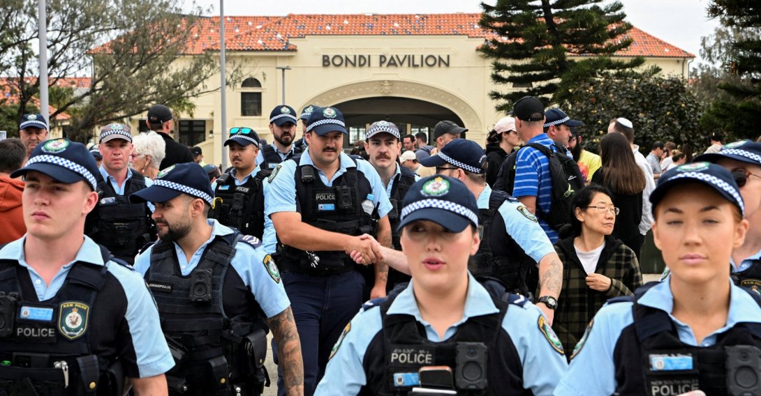 Police officers gather near Bondi Beach pavilion, at the floral memorial to honor the victims of a mass shooting at Bondi Beach, in Sydney, Australia, Dec. 16, 2025. (Reuters Photo)
