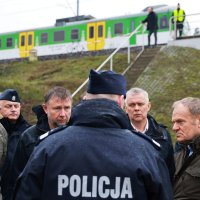 Polish Prime Minister Donald Tusk (R) visits a sabotaged rail line near Mika, Poland, Nov. 17, 2025. (AP Photo)