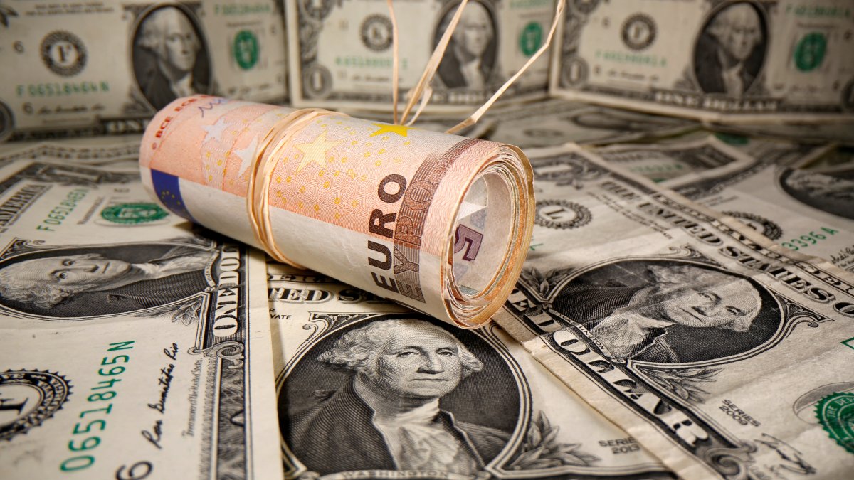 Rolled euro banknotes are placed on U.S. dollar banknotes in this illustration taken on May 26, 2020. (Reuters Photo)