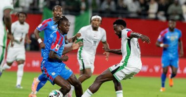 Congo's Ngal'ayel Mukau challenges Nigeria's Wilfred Ndidi during the World Cup African qualifier match between Congo and Nigeria, Rabat, Morocco, Nov. 16, 2025. (AP Photo)