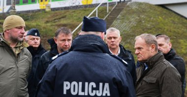 Polish Prime Minister Donald Tusk (R) visits a sabotaged rail line near Mika, Poland, Nov. 17, 2025. (AP Photo)
