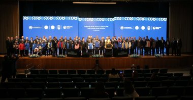 Participants pose for a family photo at the results conference of the “Zero Waste Workshop,” Muğla, southwestern Türkiye, Dec. 17, 2025. (AA Photo)