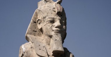 One of the two giant alabaster statues of Pharoah Amenhotep III is photographed during the official opening, in the southern city of Luxor, Egypt, Dec. 14, 2025. (AP Photo)