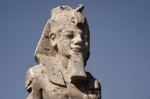 One of the two giant alabaster statues of Pharoah Amenhotep III is photographed during the official opening, in the southern city of Luxor, Egypt, Dec. 14, 2025. (AP Photo)