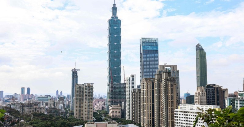 The Taipei 101 building is seen among residential and commercial buildings in Taipei, Dec. 18, 2025. (AFP Photo)