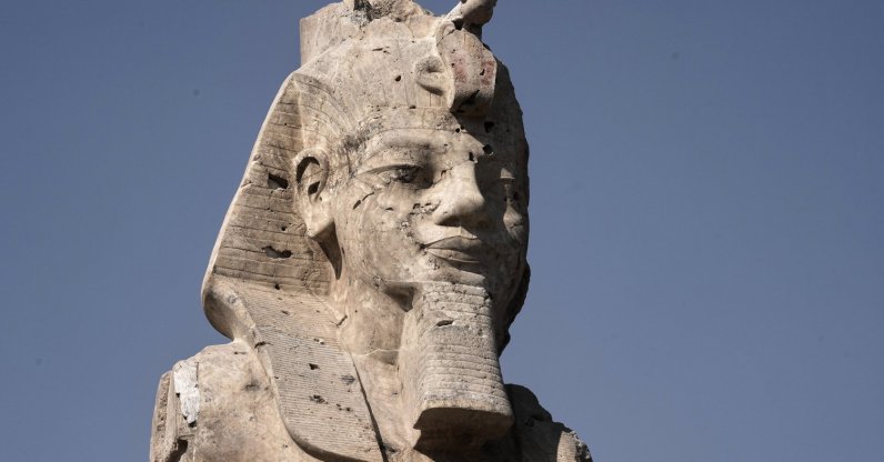 One of the two giant alabaster statues of Pharoah Amenhotep III is photographed during the official opening, in the southern city of Luxor, Egypt, Dec. 14, 2025. (AP Photo)
