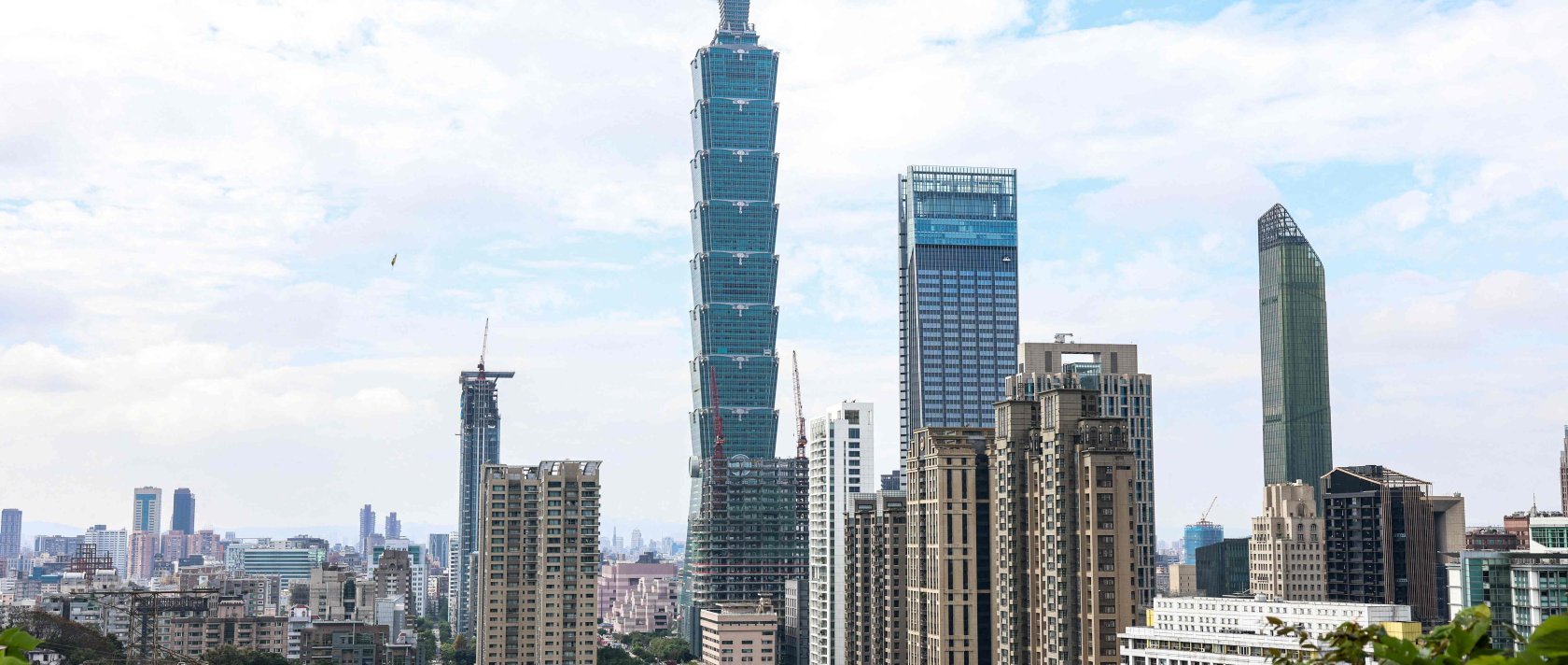 The Taipei 101 building is seen among residential and commercial buildings in Taipei, Dec. 18, 2025. (AFP Photo)