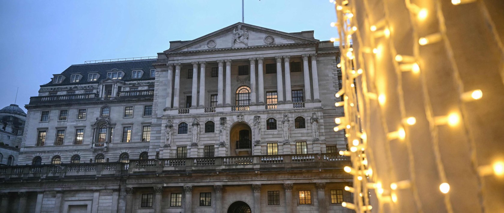 Pedestrians walk past the Bank of England (C) in central London, U.K., Dec. 18, 2025. (AFP Photo)