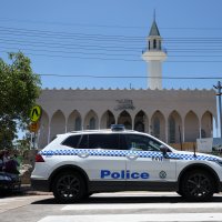 A police vehicle patrols outside Lakemba Imam Ali bin Abi Talib Mosque as people arrive for Friday prayers, amid a heightened security presence following the deadly mass shooting at Bondi Beach, Dec. 19, 2025. (Reuters Photo)