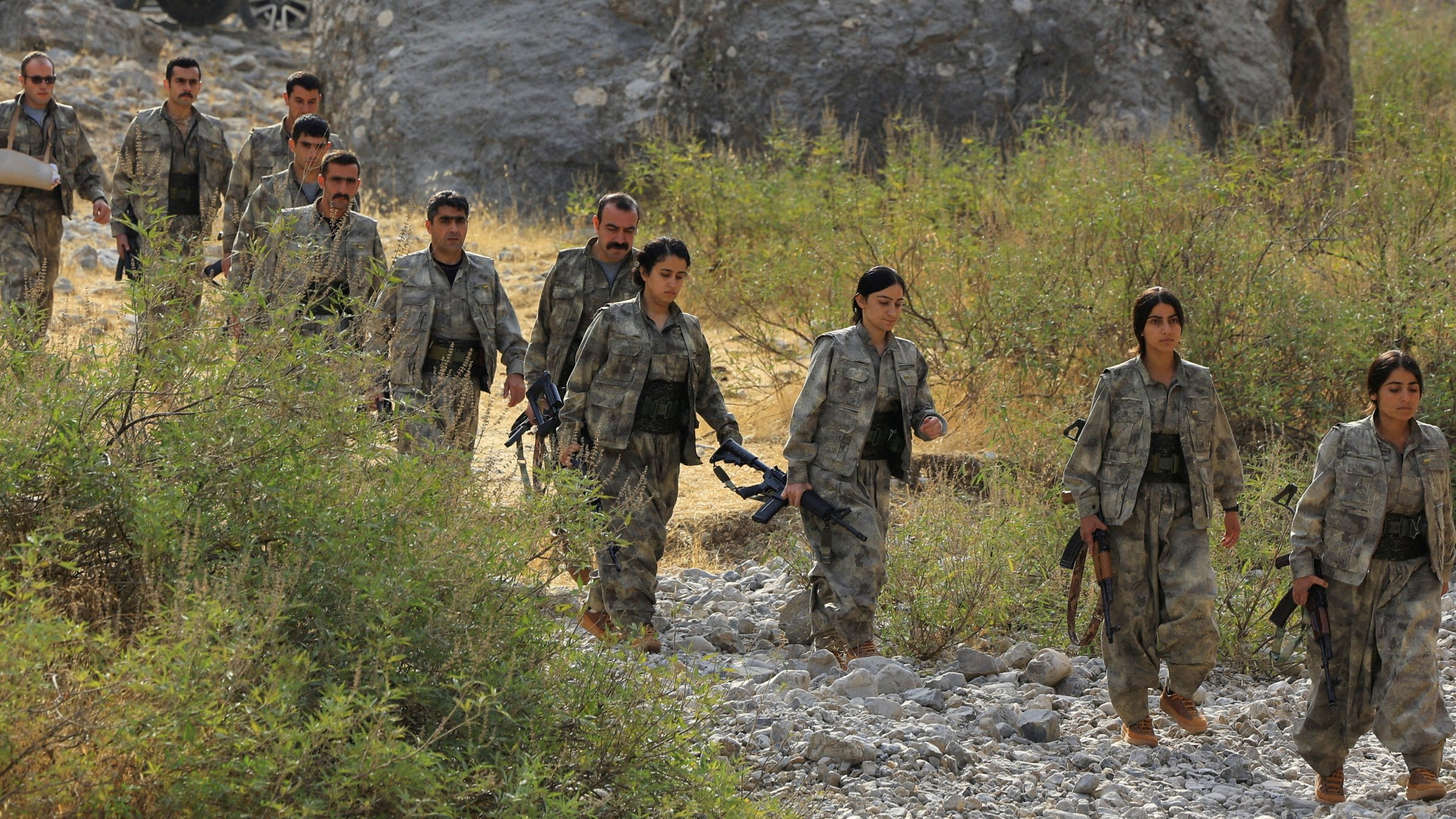 Members of the PKK terrorist group walk to a disarmament ceremony marking a significant step toward ending decades of terrorist attacks, the Qandil mountains, Iraq, Oct. 26, 2025. (Reuters Photo)