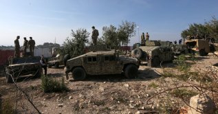  Lebanese army soldiers stand atop military vehicles during a media tour in Alma Al Shaab, near the border with Israel in southern Lebanon, Nov. 28, 2025. (EPA Photo)