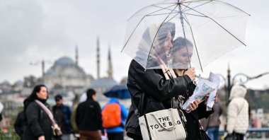 People walk in the famous Eminönü neighborhood, Istanbul, Türkiye, Dec. 7, 2025. (AA Photo)
