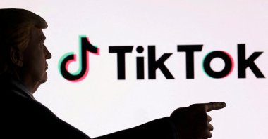 A 3D-printed miniature model depicting U.S. President Donald Trump in front of the TikTok logo is shown in this illustration taken Sept. 24, 2025. (Reuters Photo)