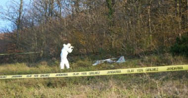An investigator probes the drone found in Izmit, Kocaeli, Dec. 19, 2025. (IHA Photo)