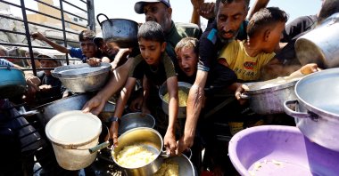 Palestinians wait to receive food from a charity kitchen after the global hunger monitor, in Gaza City, Aug. 28, 2025. (Reuters File Photo)