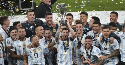 Argentina's Lionel Messi holds a trophy as he celebrates with his teammates after winning the Finalissima match against Italy at Wembley Stadium, London, U.K., June 1, 2022. (AP Photo)
