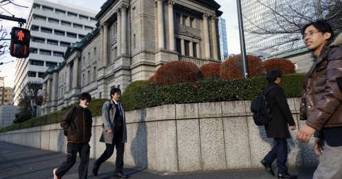 Passersby walk past the Bank of Japan (BOJ) headquarters in Tokyo, Japan, Dec. 19, 2025. (EPA Photo)