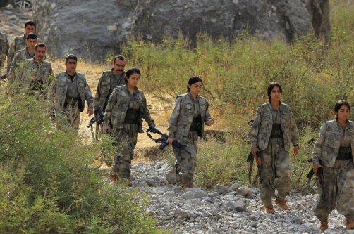 Members of the PKK terrorist group walk to a disarmament ceremony marking a significant step toward ending decades of terrorist attacks, the Qandil mountains, Iraq, Oct. 26, 2025. (Reuters Photo)