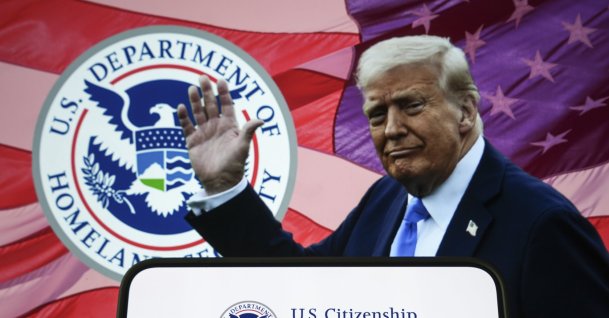 This illustration photo shows a logo of the U.S. Citizenship and Immigration Services on a smartphone with President Donald Trump and the logo of the Homeland Security Department in the background, Dec. 19, 2025. (AA Photo)