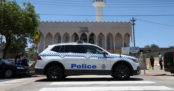 A police vehicle patrols outside Lakemba Imam Ali bin Abi Talib Mosque as people arrive for Friday prayers, amid a heightened security presence following the deadly mass shooting at Bondi Beach, Dec. 19, 2025. (Reuters Photo)