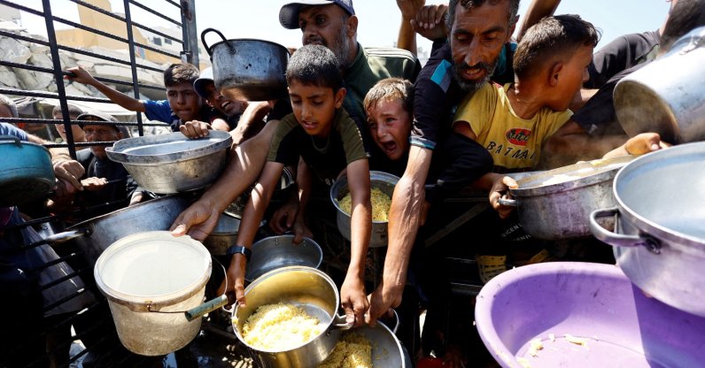 Palestinians wait to receive food from a charity kitchen after the global hunger monitor, in Gaza City, Aug. 28, 2025. (Reuters File Photo)