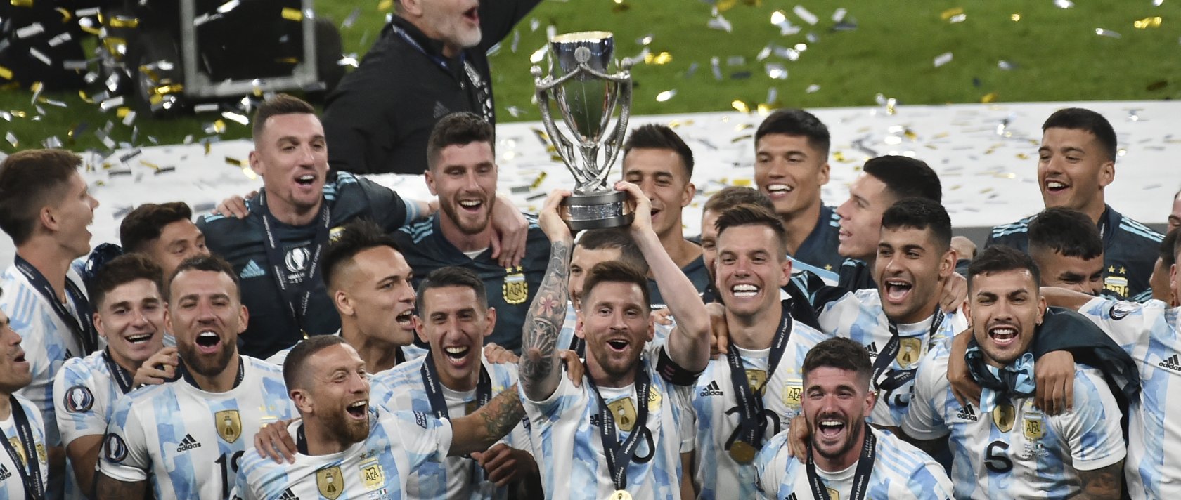 Argentina's Lionel Messi holds a trophy as he celebrates with his teammates after winning the Finalissima match against Italy at Wembley Stadium, London, U.K., June 1, 2022. (AP Photo)