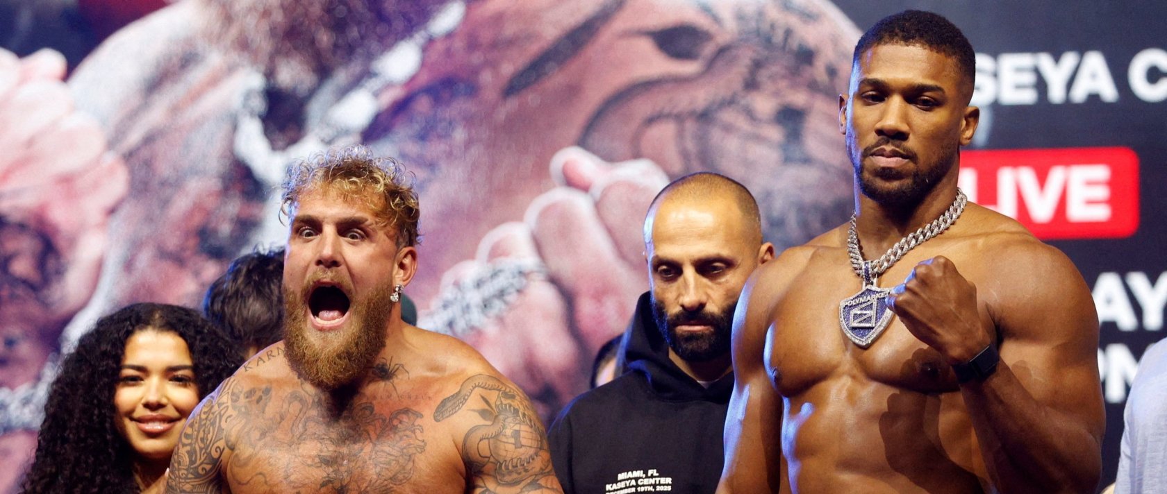 Jake Paul (L) and Anthony Joshua during the weigh-in at The Fillmore, Miami Beach, Florida, U.S., Dec. 18, 2025. (Reuters Photo)