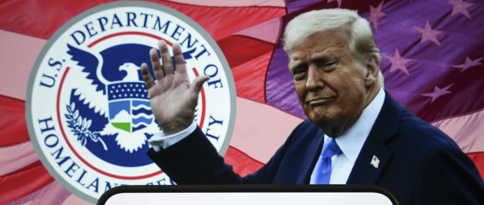 This illustration photo shows a logo of the U.S. Citizenship and Immigration Services on a smartphone with President Donald Trump and the logo of the Homeland Security Department in the background, Dec. 19, 2025. (AA Photo)