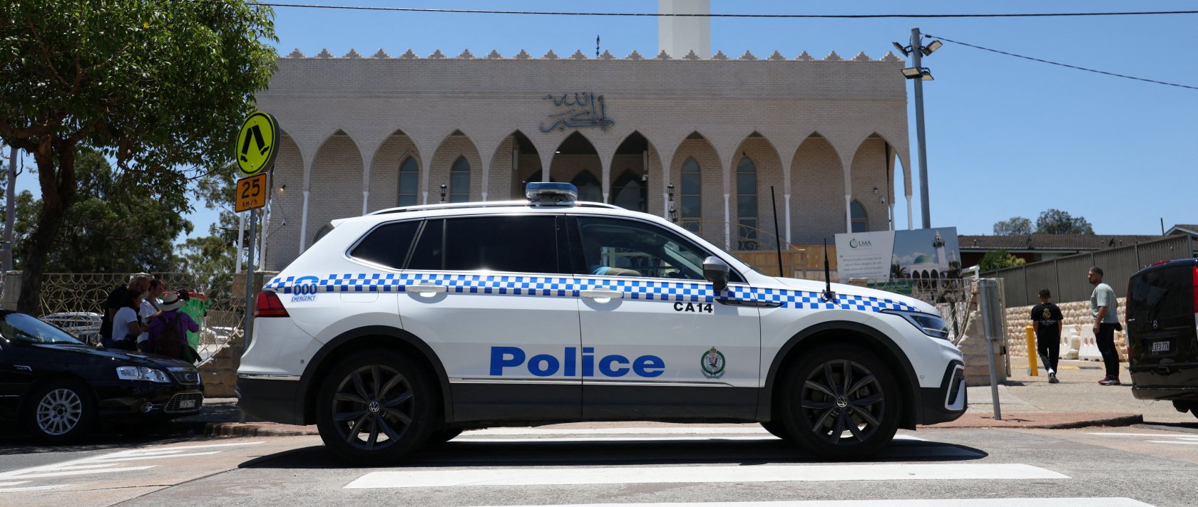 A police vehicle patrols outside Lakemba Imam Ali bin Abi Talib Mosque as people arrive for Friday prayers, amid a heightened security presence following the deadly mass shooting at Bondi Beach, Dec. 19, 2025. (Reuters Photo)