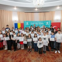 Students hold certificates after taking part in the 11th Traditional Turkish Poetry Recitation Contest organized by the Yunus Emre Institute in Constanța, Romania, Dec. 10, 2025. (AA Photo)