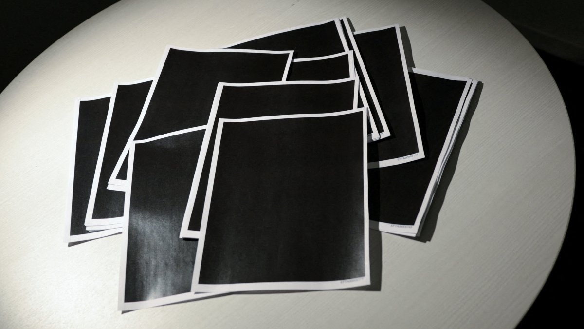 Newly-released documents from disgraced late financier and sex offender Jeffrey Epstein, including a sheaf of entirely redacted pages, are seen in Washington, D.C., U.S., Dec. 19, 2025. (Reuters Photo)