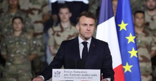 France's President Emmanuel Macron addresses French troops during a ceremony at the 5th Cuirassier Regiment's base in Zayed Military City, near Abu Dhabi, United Arab Emirates (UAE), Dec. 21, 2025. (AFP Photo)