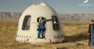 This image provided by Blue Origin, Michaela Benthaus poses after the Blue Origin's capsule landed, West Texas, U.S., Dec. 20, 2025. (AP Photo)