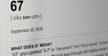 This Dictionary.com page shows the newest word of the year "6-7" on a computer screen, Chicago, U.S., Oct. 30, 2025. (AP Photo)