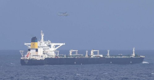 A U.S. military helicopter flies over the Panama-flagged Centuries, which was intercepted by the U.S. Coast Guard, days after U.S. President Donald Trump announced a &amp;amp;quot;blockade&amp;amp;quot; of all sanctioned oil tankers entering and leaving Venezuela, east of Barbados in the Caribbean Sea, Dec. 20, 2025. (Reuters Photo)
