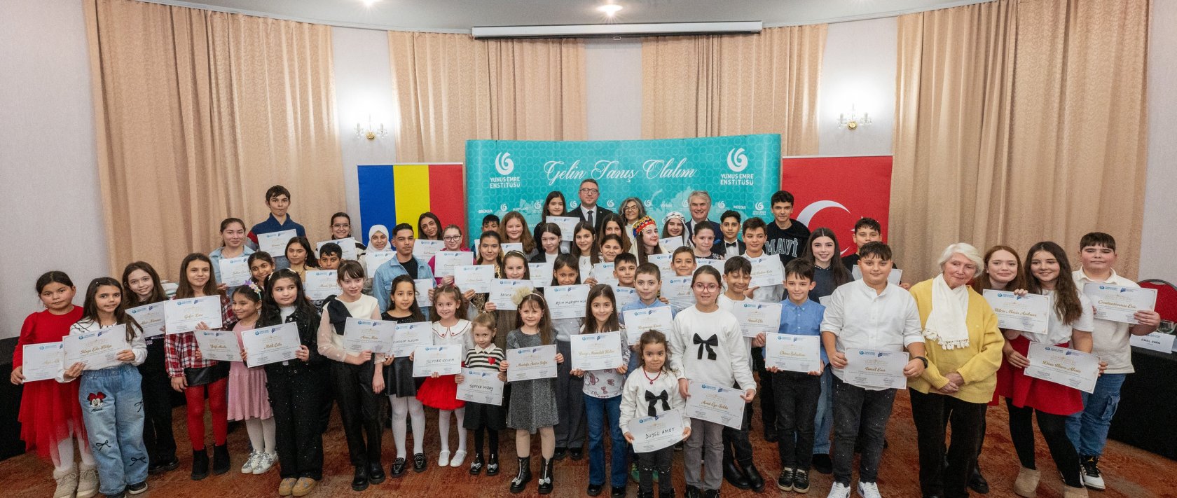 Students hold certificates after taking part in the 11th Traditional Turkish Poetry Recitation Contest organized by the Yunus Emre Institute in Constanța, Romania, Dec. 10, 2025. (AA Photo)