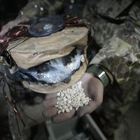 A Syrian member of the anti-regime alliance shows amphetamine pills known as Captagon hidden inside an electrical component at a warehouse, in Douma city, outskirts of Damascus, Syria, Dec. 13, 2024. (AP Photo)