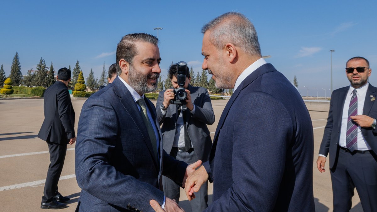 Syrian Foreign Minister Asaad al-Shaibani (L) welcomes Foreign Minister Hakan Fidan (R) at the airport, Damascus, Syria, Dec. 22, 2025. (AA Photo)