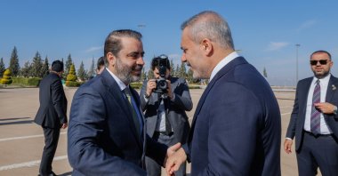 Syrian Foreign Minister Asaad al-Shaibani (L) welcomes Foreign Minister Hakan Fidan (R) at the airport, Damascus, Syria, Dec. 22, 2025. (AA Photo)