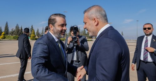 Syrian Foreign Minister Asaad al-Shaibani (L) welcomes Foreign Minister Hakan Fidan (R) at the airport, Damascus, Syria, Dec. 22, 2025. (AA Photo)