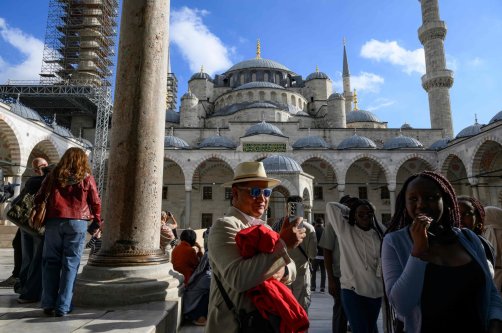 Tourists visit Sultanahmet Mosque, also known as the Blue Mosque, Istanbul, Türkiye, Nov. 24, 2025. (AFP Photo)