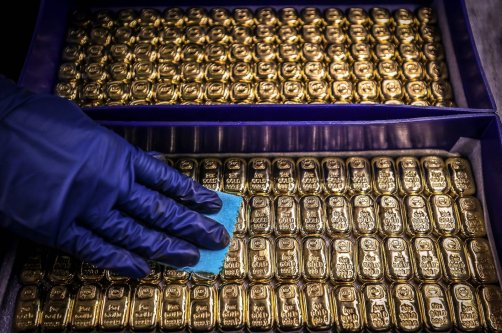 A worker polishes gold bullion bars at the ABC Refinery, Sydney, Australia, Aug. 5, 2020. (AFP Photo)