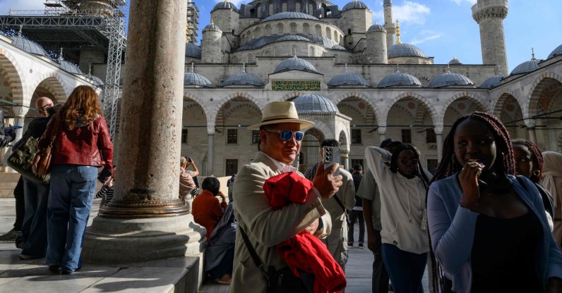 Tourists visit Sultanahmet Mosque, also known as the Blue Mosque, Istanbul, Türkiye, Nov. 24, 2025. (AFP Photo)
