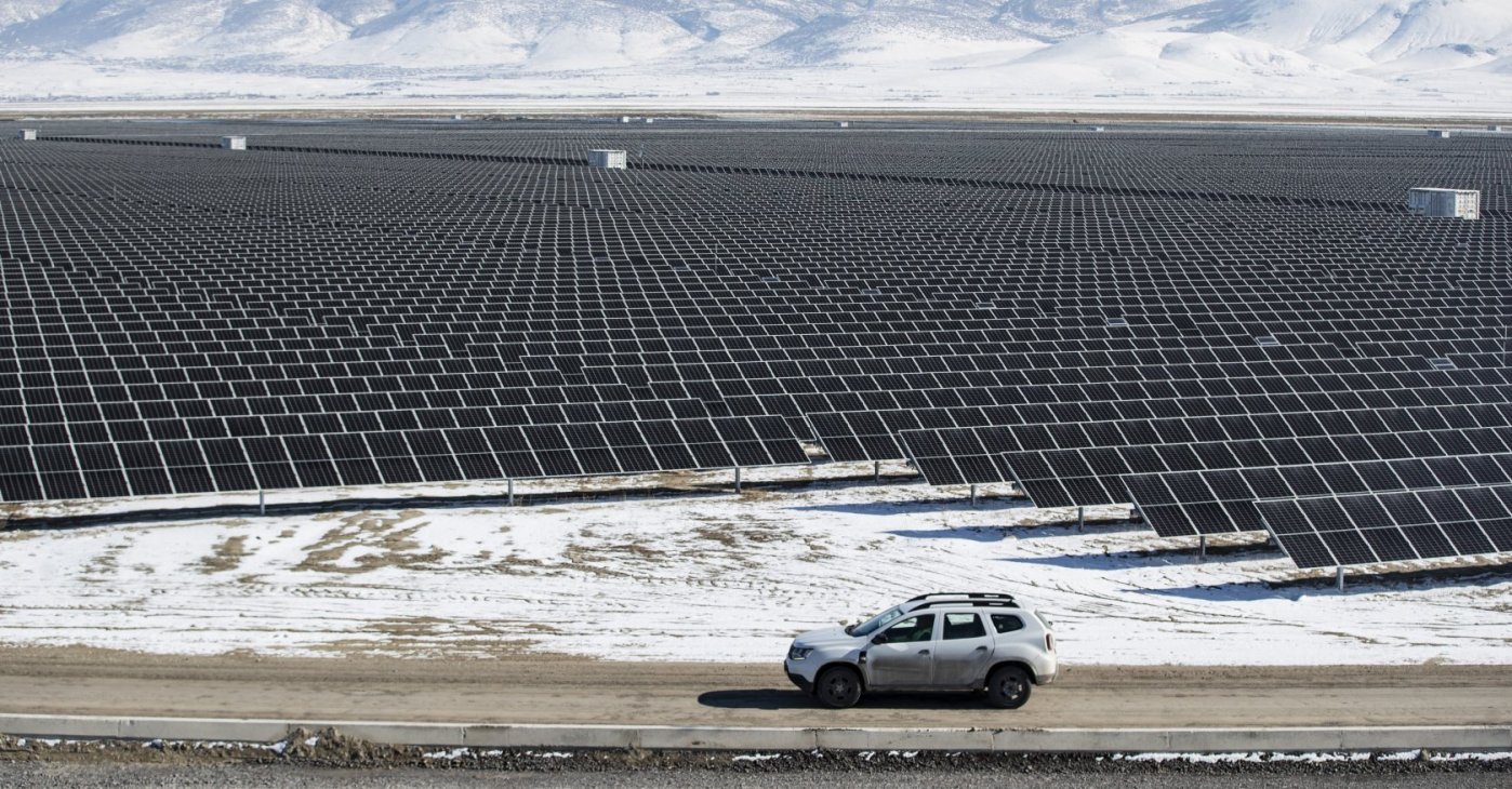 Technicians drive a car past photovoltaic panels at the Kalyon PV Karapınar Solar Power Plant, Konya, central Türkiye, Feb. 2, 2023. (EPA Photo)
