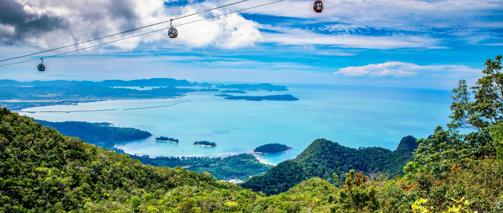 A view of a breathtaking cable car ride over tropical islands and the serene ocean, Langkawi, Malaysia. (Shutterstock Photo)