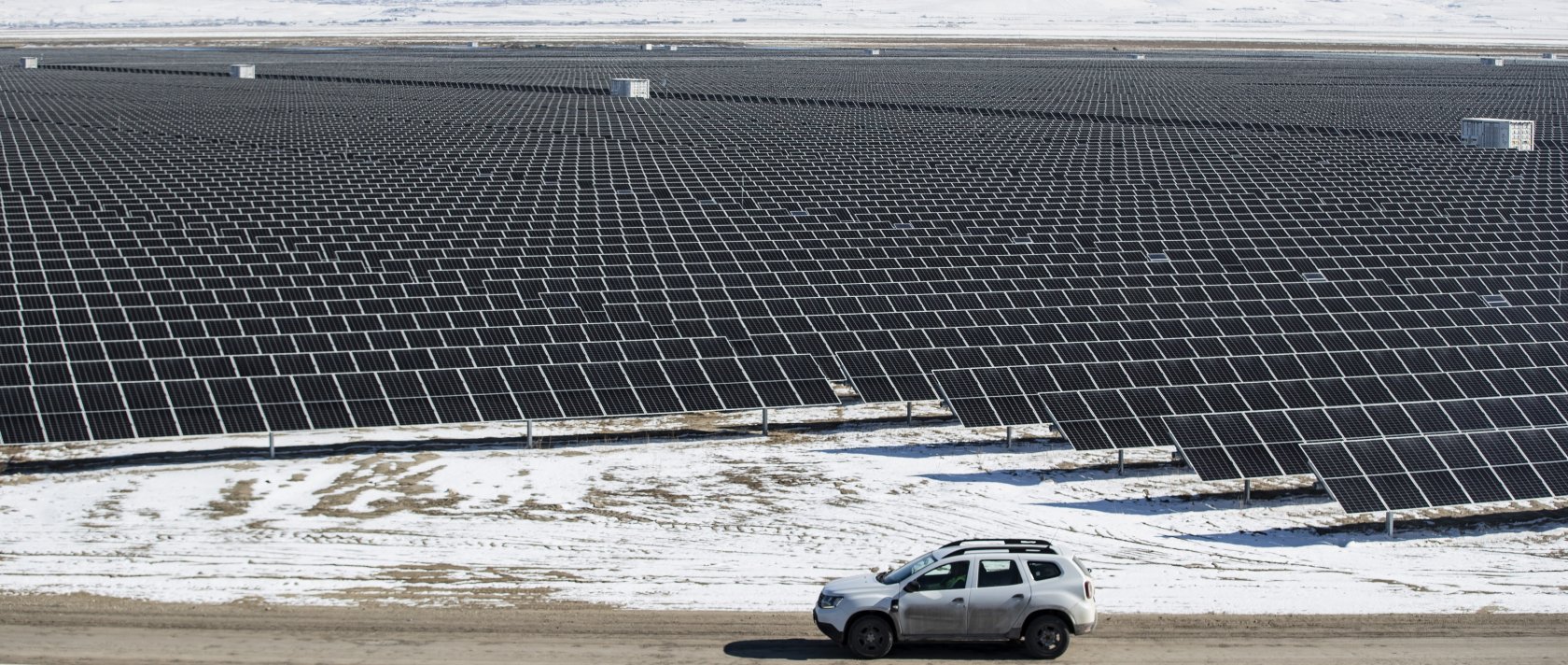 Technicians drive a car past photovoltaic panels at the Kalyon PV Karapınar Solar Power Plant, Konya, central Türkiye, Feb. 2, 2023. (EPA Photo)