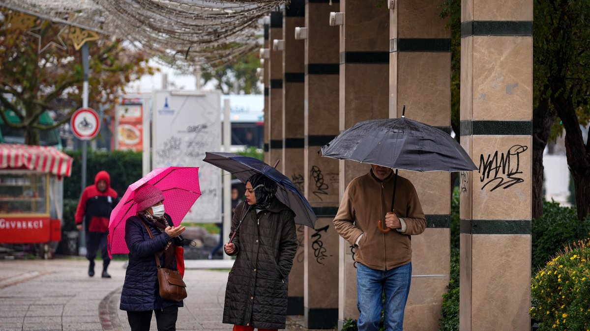 Residents use umbrellas as heavy rain affects the Konak district, Izmir, Türkiye, Dec. 5, 2025. (AA Photo)
