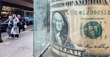 People walk past a currency exchange office in Cairo, Egypt, Dec. 2, 2025. (EPA Photo)